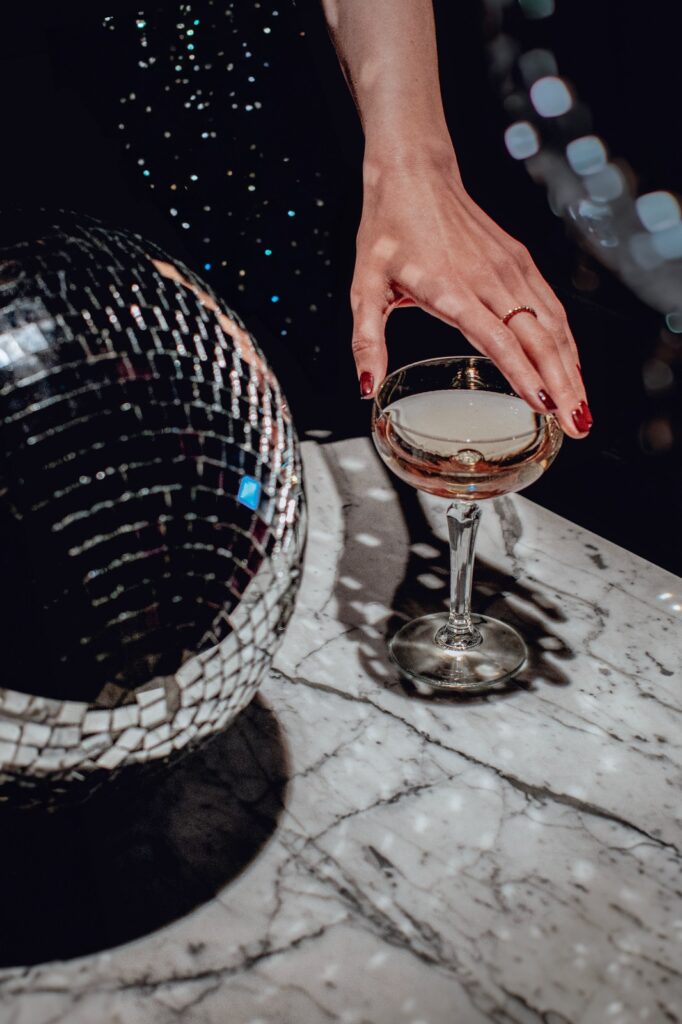 A cocktail and a disco ball at a party at Pullman Tbilisi
