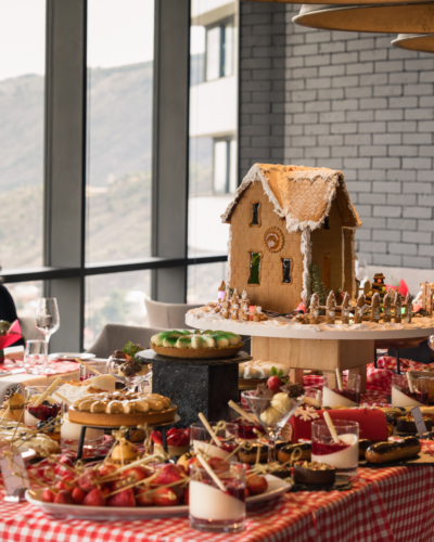 Gingerbread house on the Christmas dessert table at Dumas