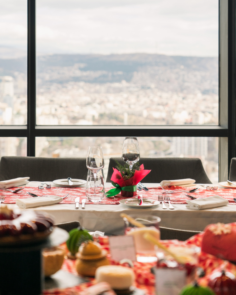Festive table set for the Christmas brunch at Dumas with a view over Tbilisi