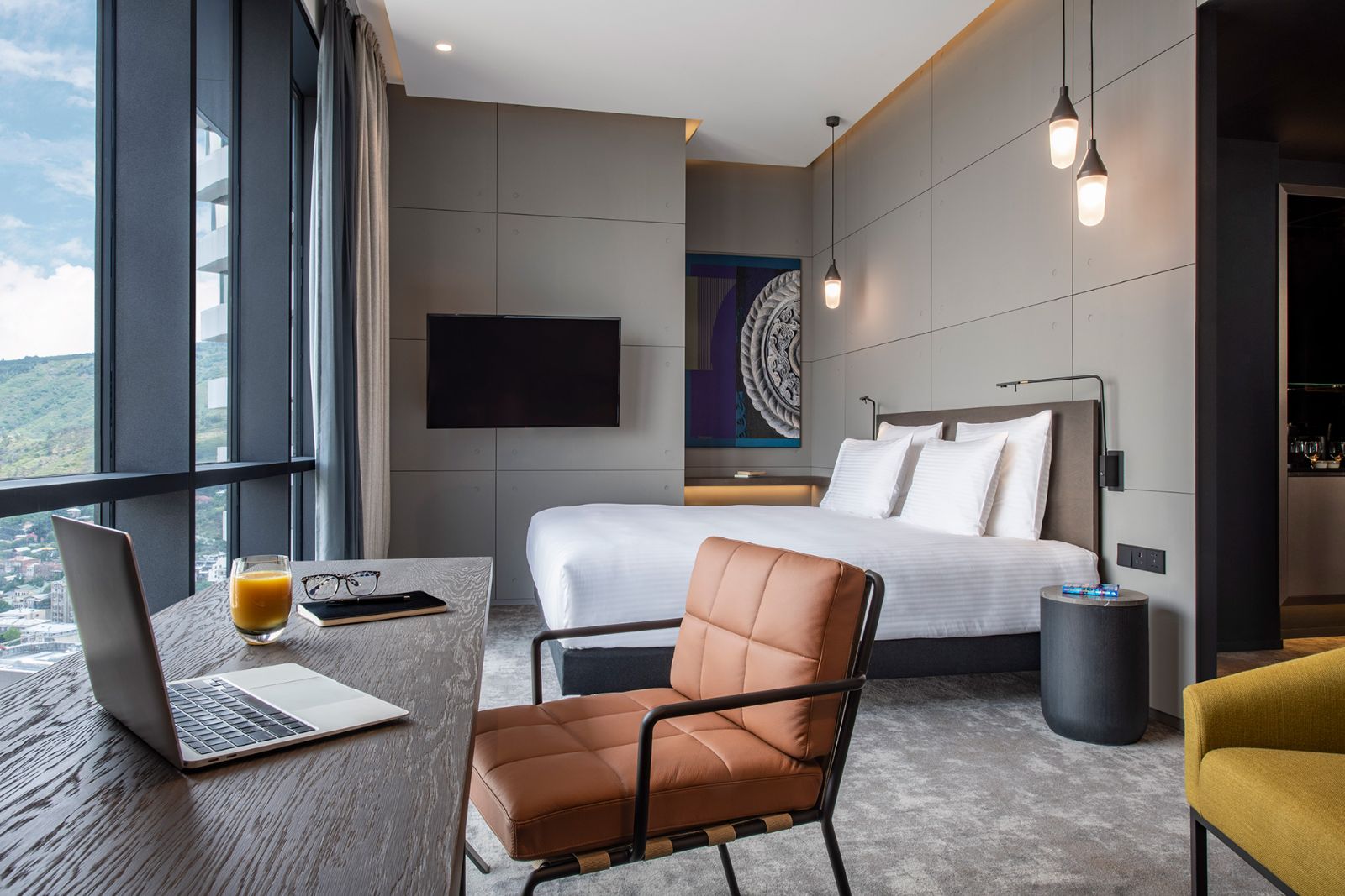 Executive Room with a king bed and leather armchair, Pullman Tbilisi Axis Towers