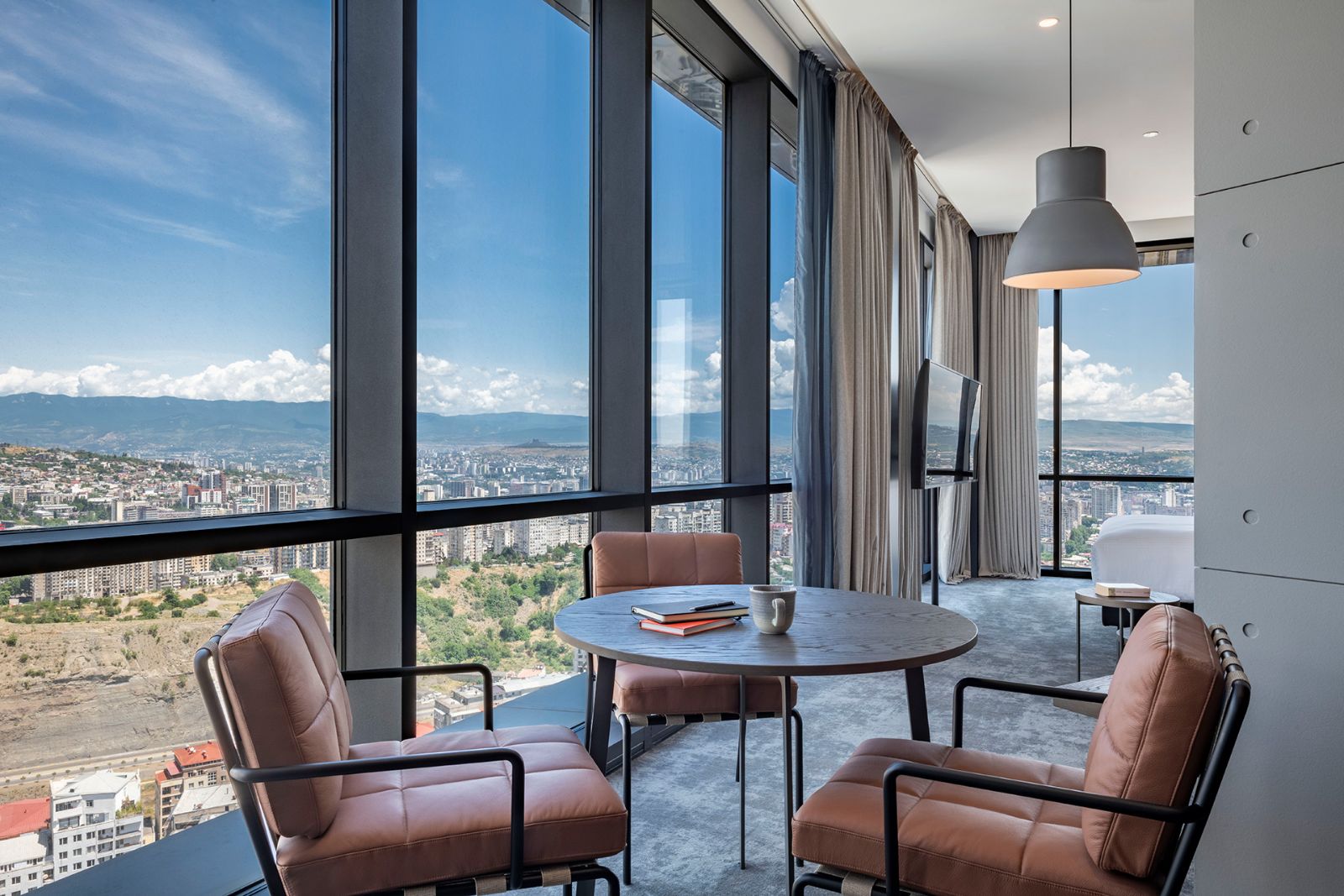 Junior Suite dining table by the window, Pullman Tbilisi Axis Towers