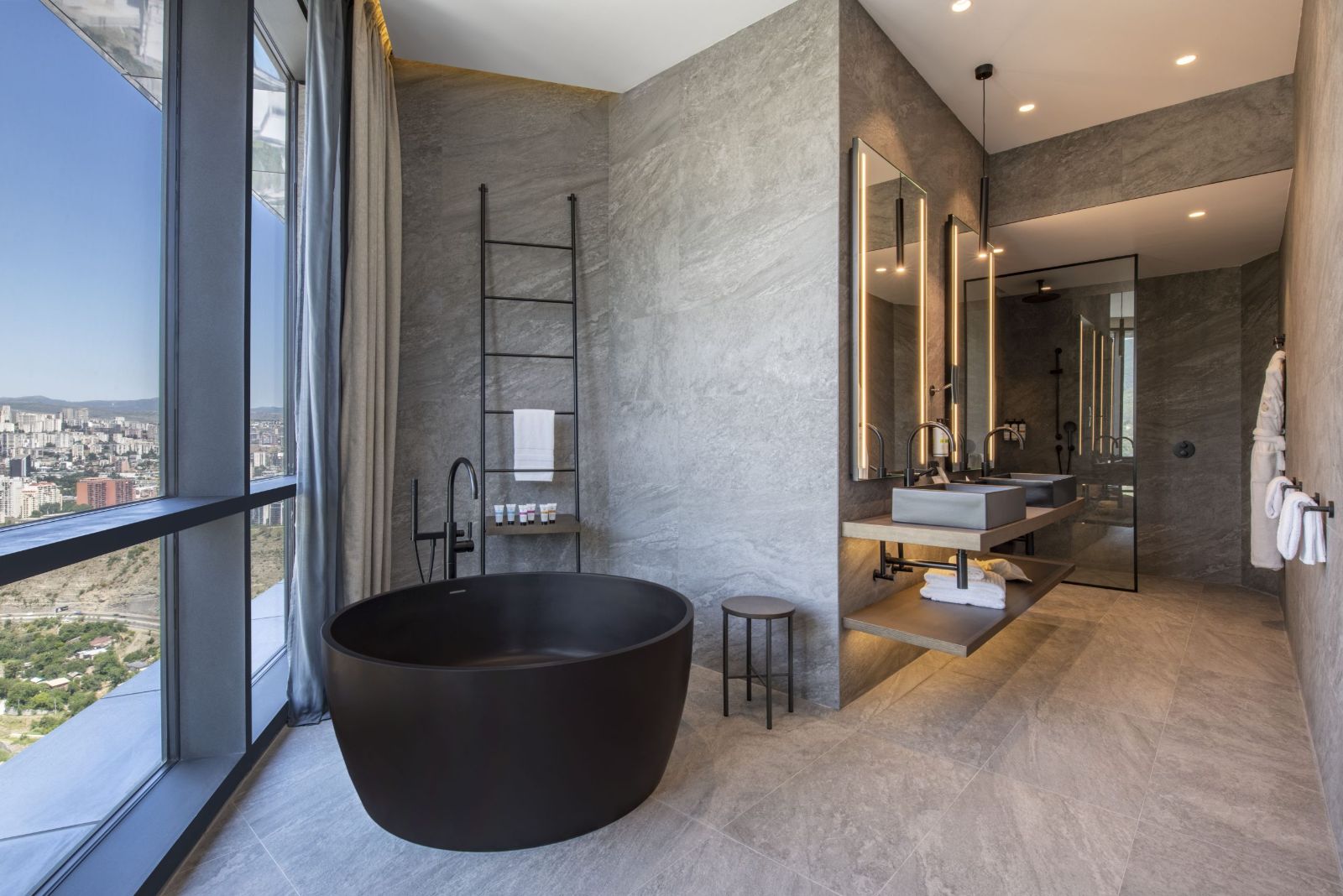 Superior Suite bathroom with a freestanding bathtub, Pullman Tbilisi Axis Towers