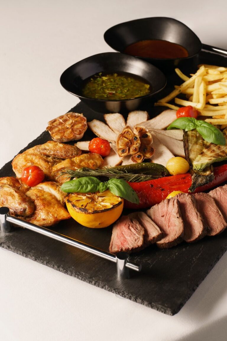 Grilled steak and meat platter with sauces at Dumas, Tbilisi