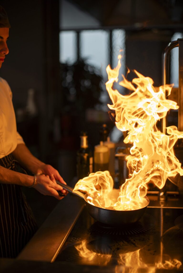 Flames on the grill in the open kitchen at Dumas, Tbilisi