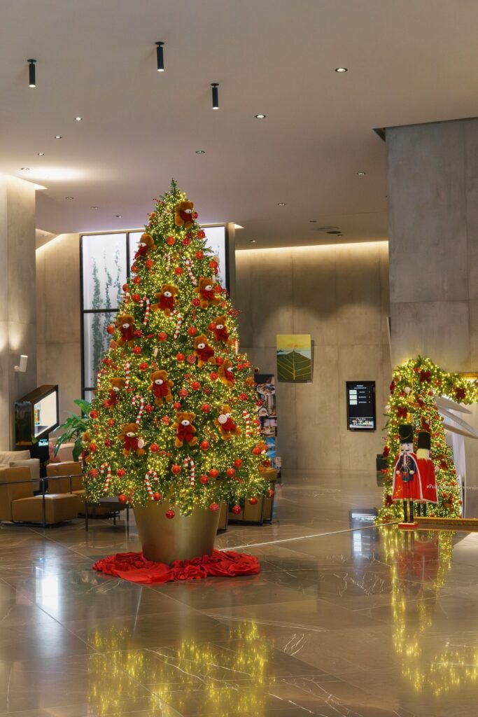 Christmas tree with red ornaments in the Pullman Tbilisi lobby